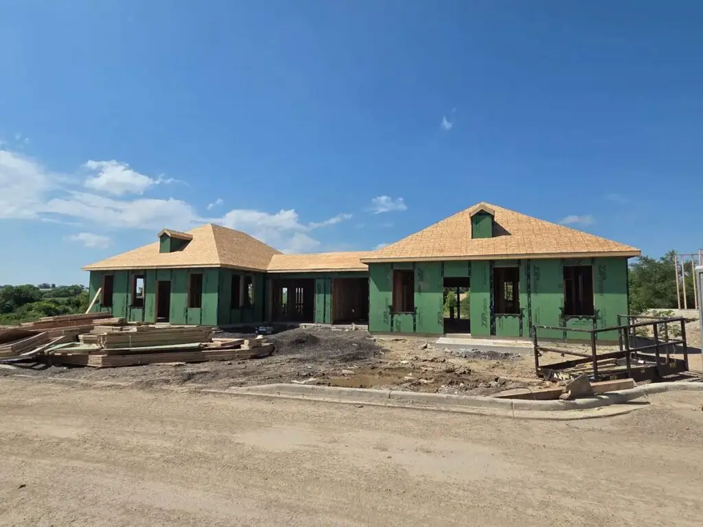Two newly framed single family homes in a residential development.